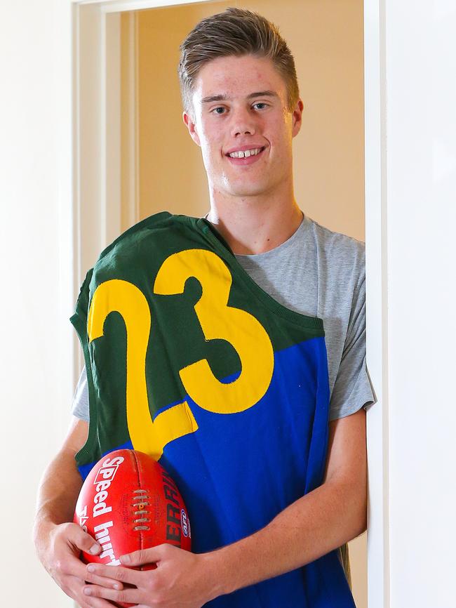 Schache, pictured with his late fathers' Woodville-West Torrens jumper, after he was drafted by the Lions. Picture: Ian Currie