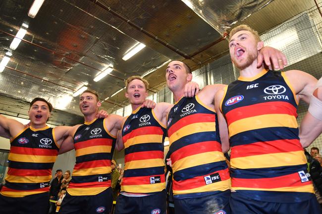 Crows players sing the club song after beatiing the Fremantle Dockers in the Round 7 match at Adelaide Oval. Picture: David Mariuz/AAP