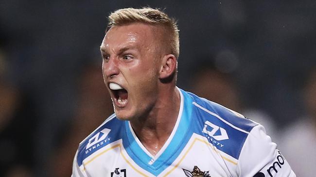 SYDNEY, AUSTRALIA - MAY 08: Tanah Boyd of the Titans celebrates scoring a try during the round nine NRL match between the Wests Tigers and the Gold Coast Titans at Campbelltown Sports Stadium, on May 08, 2021, in Sydney, Australia. (Photo by Matt King/Getty Images)