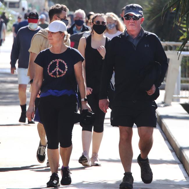 Surfers Paradise wakes up to its first day in lockdown due to the latest Covid-19 scare. Crowds walking around Surfers Paradise without masks. Picture Glenn Hampson