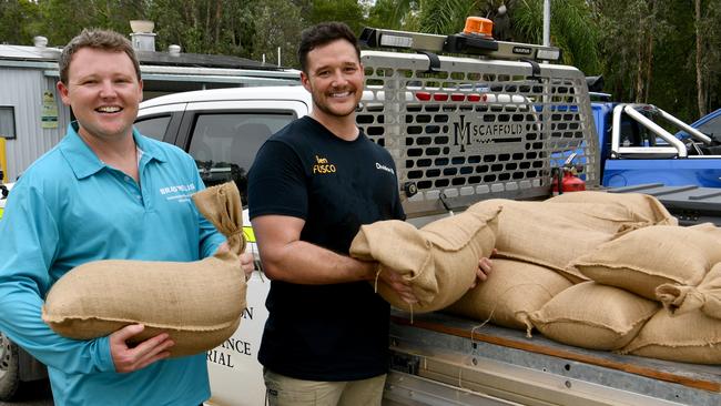 Cungulla residents prepare for Cyclone Kirrily. Division 10 candidate Brady Ellis with Division 10 Cr Ben Fusco with sandbags at the the community hall. Picture: Evan Morgan