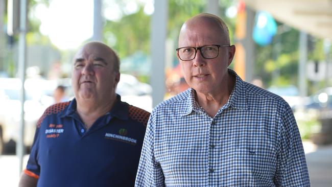 LNP Opposition leader Peter Dutton on the ground in Ingham with Mayor Ramon Jayo.