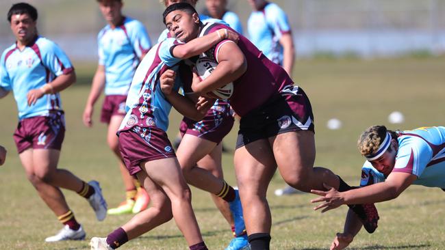 Finals of the Titans Schools League at Keebra Park Oval. Keebra Park v Marsden (open boys div 1). Marsdens Brock Campbell cops it on the chin..Picture Glenn Hampson