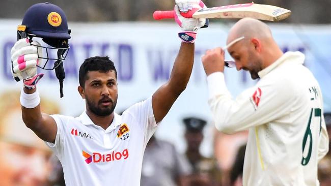 Sri Lanka's Dinesh Chandimal celebrates after scoring a century at Galle. (Photo by ISHARA S. KODIKARA / AFP)