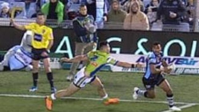 The touch judge raises his flag as Sione Katoa runs away to score a vital try.