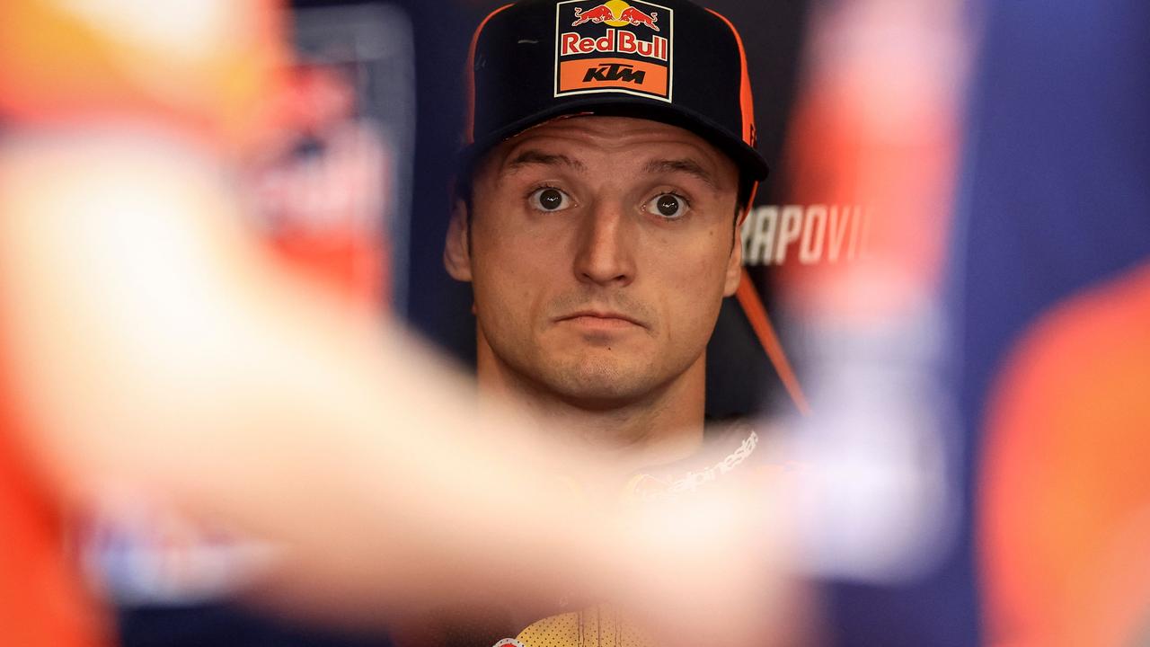 KTM Australian rider Jack Miller looks on in the box ahead of the MotoGP qualifying session of the Portuguese Grand Prix at the Algarve International Circuit in Portimao on March 23, 2024. (Photo by PATRICIA DE MELO MOREIRA / AFP)