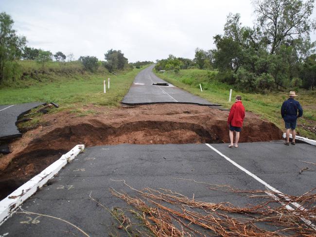 A bridge over Yatton Creek in north Queensland is partially washed away in the flooding rain that followed Cyclone Debbie.