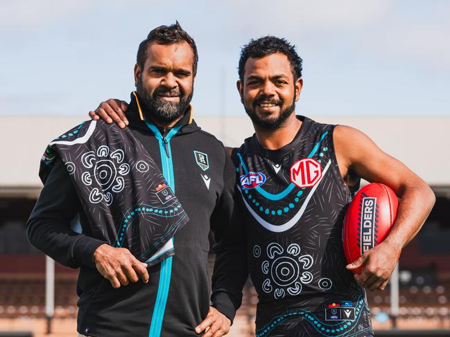 Byron Pickett and Willie Rioli with Port Adelaide's 2024 Indigenous guernsey for Sir Doug Nicholls Round. Picture: Matt Sampson