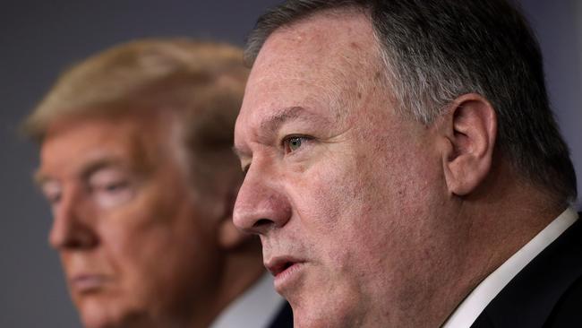 Then U.S. Secretary of State Mike Pompeo speaks as President Donald Trump listens during a news briefing on the latest development of the coronavirus outbreak in 202. Picture: AFP