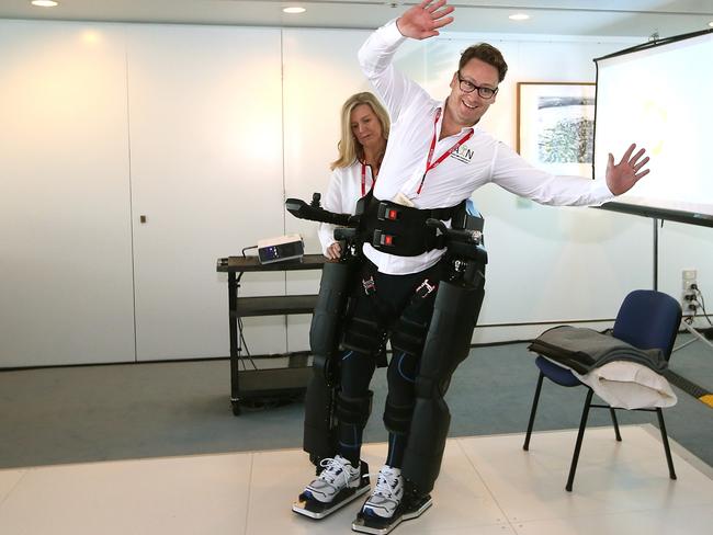 Exoskeletons such as this support paralysed people while they learn to move again after the nasal cell transplant. Picture: News Corp Australia