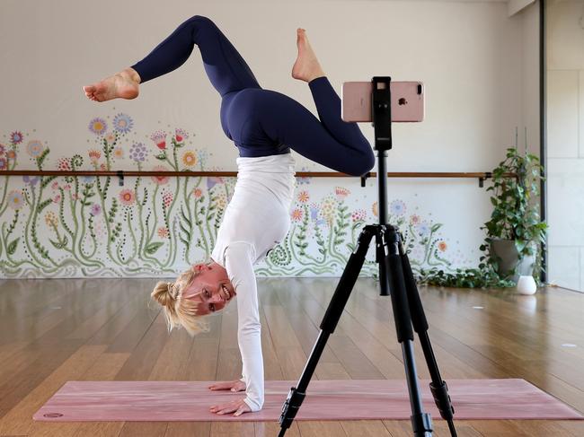 Yoga teacher Kate Kendall connects with clients in a Zoom yoga class. Picture: Toby Zerna