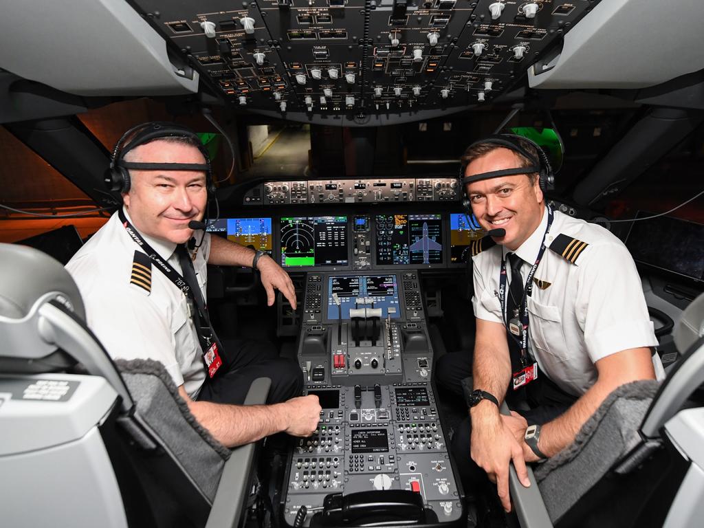 Captain Sean Golding (left) and first officer Jeremy Sutherland prepare to fly to Australia on October 18, 2019 on the flight from New York to Sydney. Picture: James D. Morgan/Getty Images for Qantas.