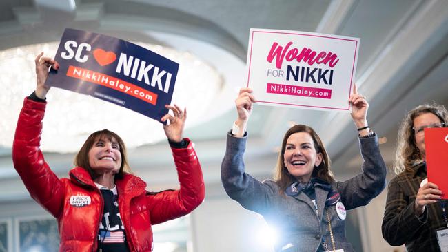 Supporters of Republican presidential candidate former U.N. Ambassador Nikki Haley dance and wave signs during a primary election night party in Charleston, South Carolina. Picture: Sean Rayford/Getty Images