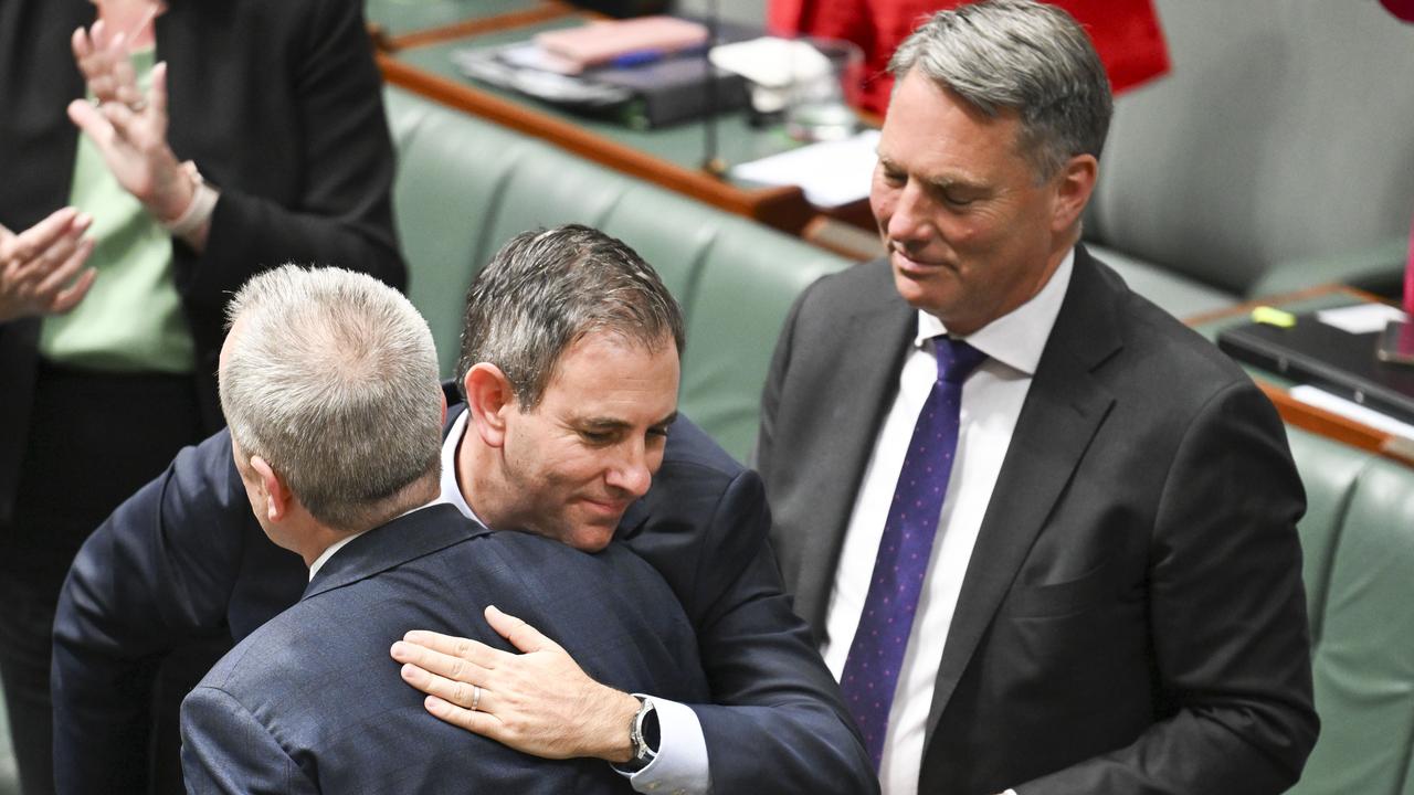 Treasurer Jim Chalmers was among the first to leap up and give Mr Shorten a hug. Picture: NewsWire / Martin Ollman