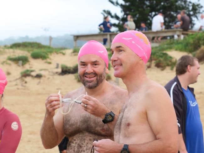 Members of the Peninsula Ocean Swimmers group get ready to attempt to swim around Lion Island. Picture: Richard Noone