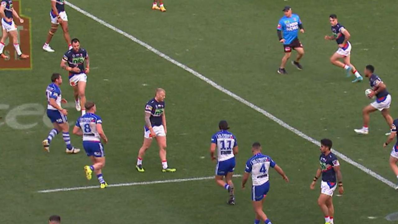 David Klemmer (left) jogs away from Knights trainer Hayden Knowles (light blue shirt) during Newcastle’s match against the Bulldogs.