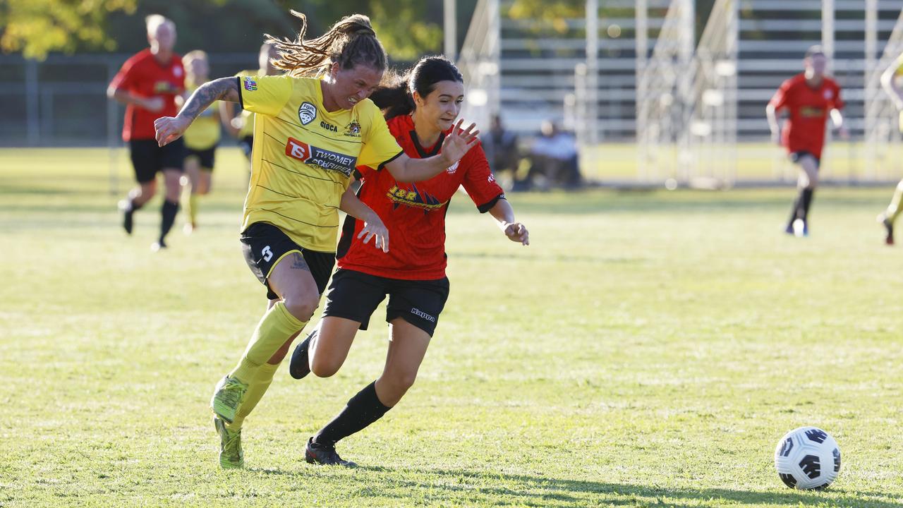 Tigers' Siobhan Macken and Lions' Reese Tyson fight for possession. Picture: Brendan Radke