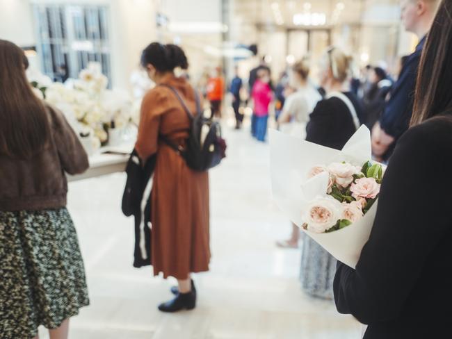 There were sombre scenes, as people flocked to pay their respects. Picture: Dion Georgopoulos - Pool/Getty Images