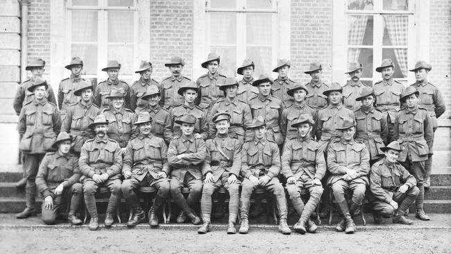 ‘An act of signal courage’ … Arthur Dean is kneeling on the left in the front row of this group shot of 12th Field Company Engineers non-commissioned officers, having been promoted to lance corporal after August 8, 1918. Photos cannot be found of Campbell or Ralph Hunt, mentioned below. Picture: Australian War Memorial.