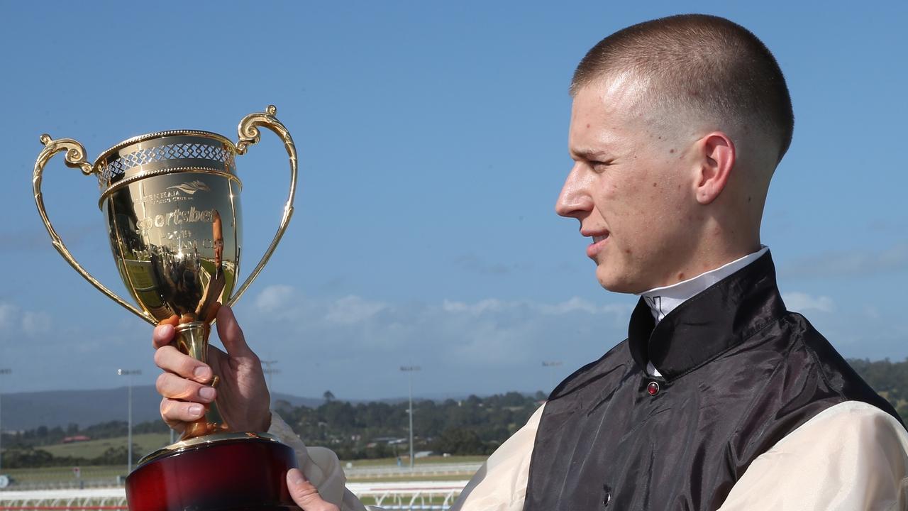 Jockey Fred Kersley enjoys the spoils of victory after riding Etrah James to an upset win in the Pakenham Cup. Picture: AAP