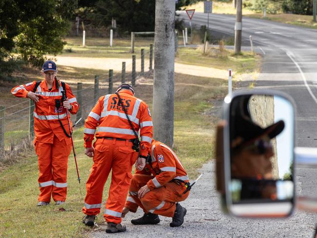 SES members search for clues along Eureka Street in Ballarat. Picture: Diego Fedele