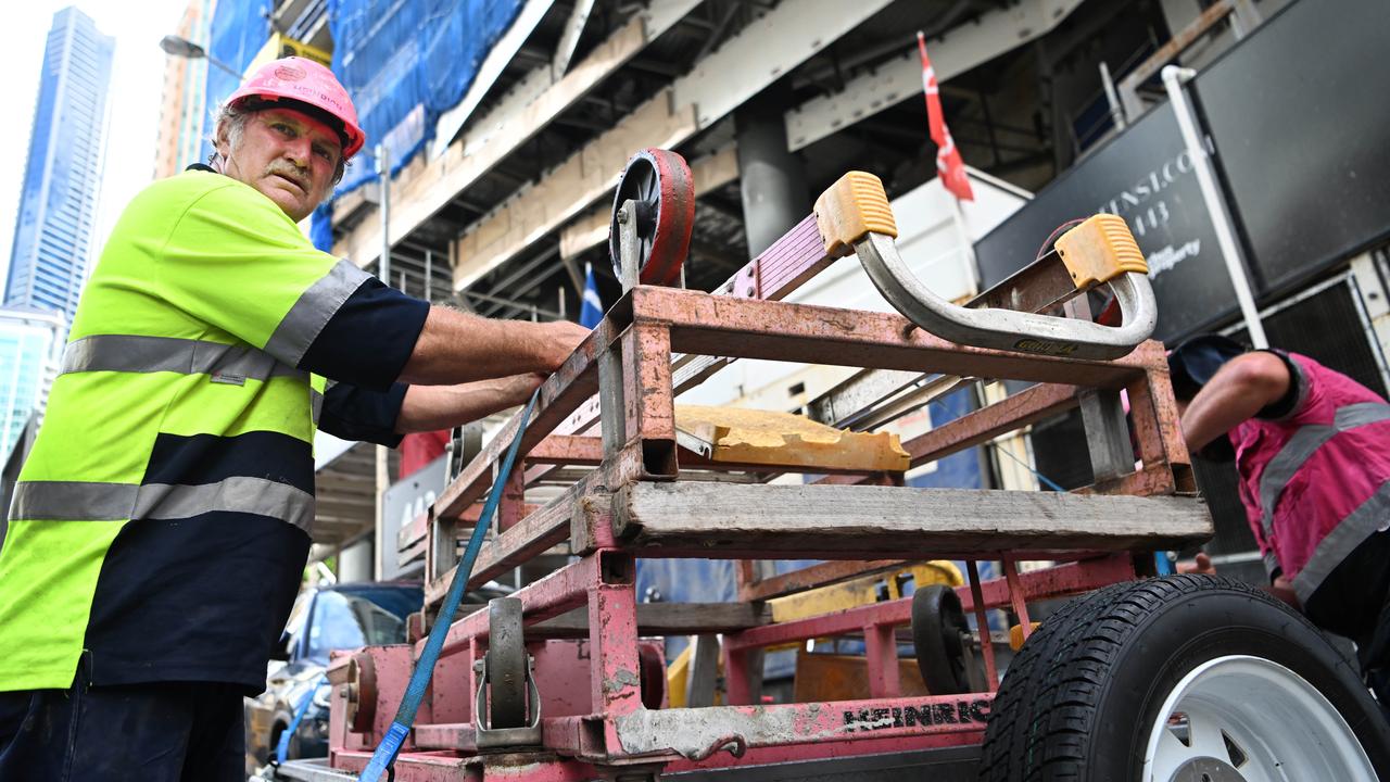 Sub-contractors and tradesmen pack up their equipment and walk off the 443 Queens Street construction site in Brisbane. Picture: Dan Peled/NCA NewsWire