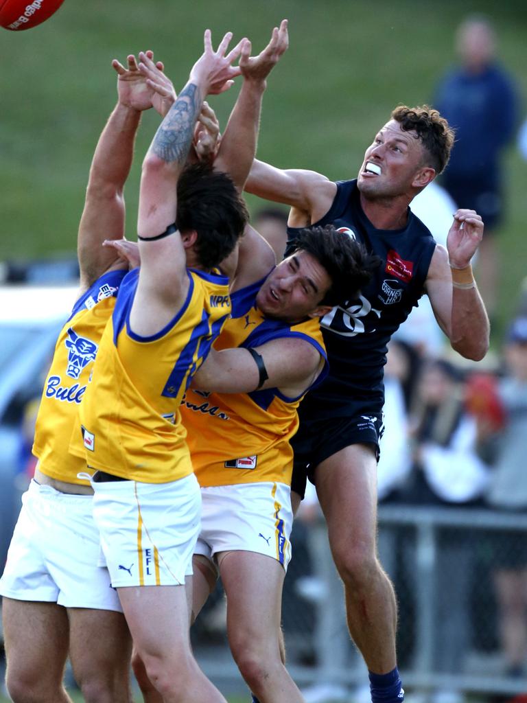 Eastern: Michael Riseley puts a fist on the bal for Berwick. Picture : Stuart Milligan