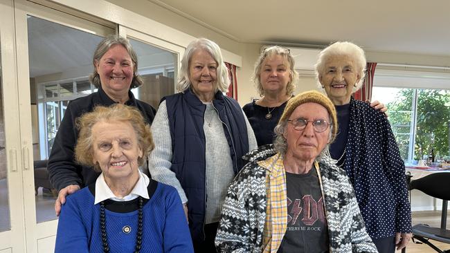 Back row: Dianne Brein, Bernie Dean, Maree Eddings, Kate Smorty. Front row: Sybil Reddan and Michael Brereton at Feros Care in Byron Bay who are adamant to stay where 6 fellow residents that left have since died.