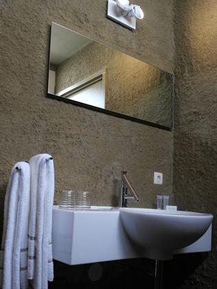 Washing off the sand in the bathroom of the Zand Hotel.