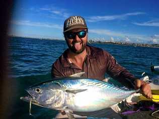 Jadeo Schmidt with a tuna he caught off the Gold Coast.