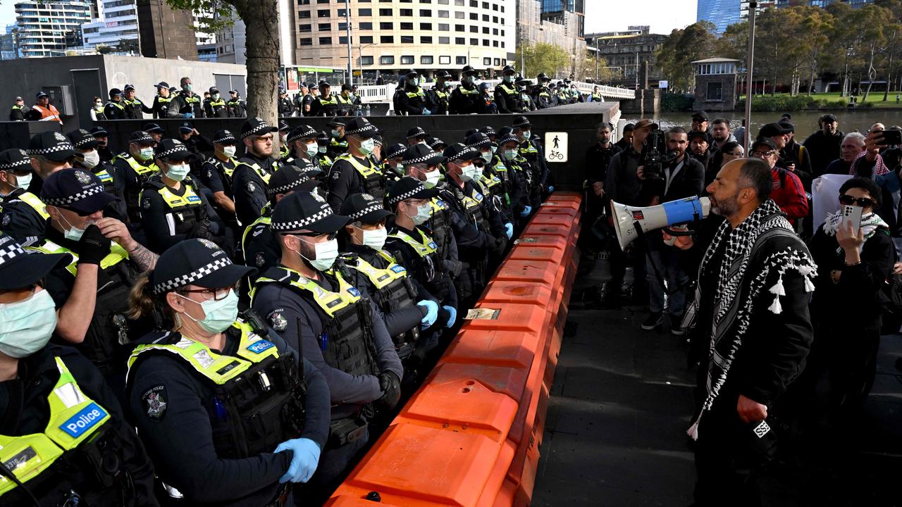 Protesters confront police during protests at the Land Forces 2024 arms fair in Melbourne on September 12, 2024. (Photo by William WEST / AFP)