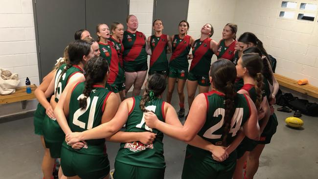 The Sandgate girls sing the Hawks' victory song.