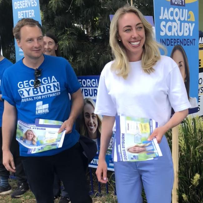 Liberal candidate in the Pittwater by-election, Georgia Ryburn, Meredith, with Liberal Manly MP, James Griffin, handing out how-to-vote pamphlets at the Ted Blackwood Community Centre in Warriewood on Saturday. Picture: Jim O’Rourke