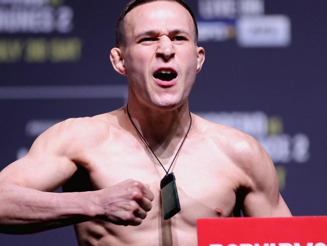 DALLAS, TEXAS - JULY 29: Kai Kara-France of New Zealand poses on the scale during the UFC 277 ceremonial weigh-in at American Airlines Center on July 29, 2022 in Dallas, Texas. (Photo by Carmen Mandato/Getty Images)