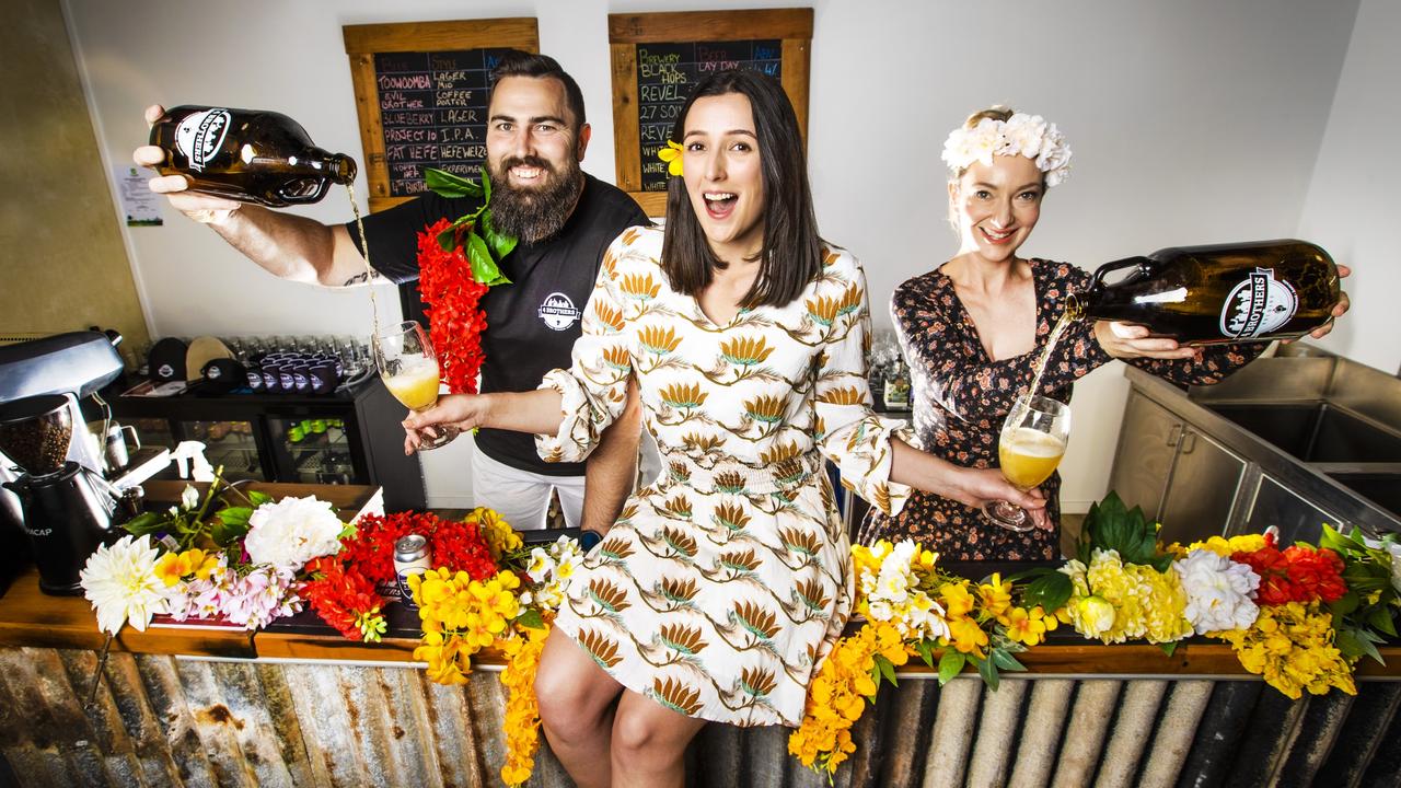 CARNIVAL TIME: Maddison Cross gets a taste of the Spring Blossom beer from 4 Brothers Brewing owners Adrian Cubit (left) and Josie Adams ahead of the 2021 Toowoomba Carnival of Flowers. Picture: Nigel Hallett