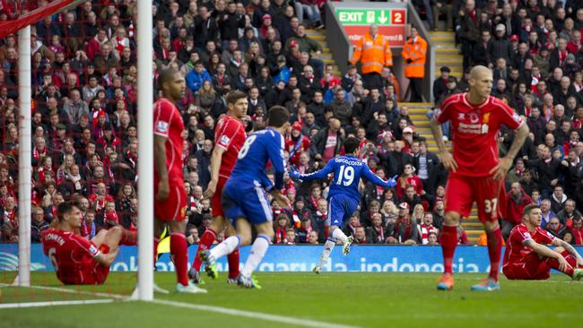 Chelsea's Diego Costa, centre right, celebrates after scoring during the English Premier League soccer match between Liverpool and Chelsea at Anfield Stadium, Liverpool, England, Saturday Nov. 8, 2014. (AP Photo/Jon Super)