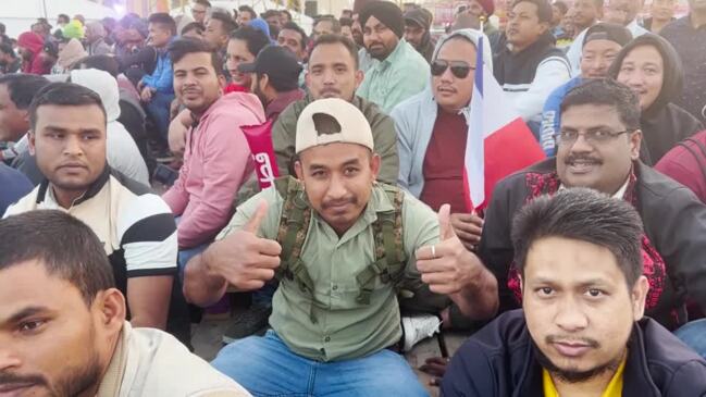 Migrant workers arrive to watch World Cup final