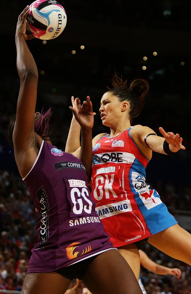 Firebirds Romelda Aiken and NSW Sharni Layton in full flight.