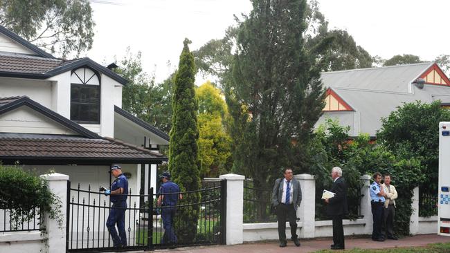 Forensic officers enter the Burnside home of Wei Li and his parents. Picture: Tricia Watkinson.