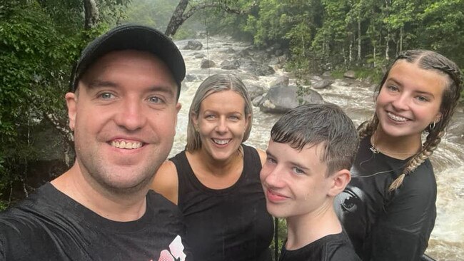 Nick Love enjoying the rain with his family at the Mossman Gorge on Monday, north of Port Douglas. Photo: Facebook.