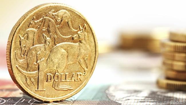 Aussie one dollar coins, on a twenty dollar note.