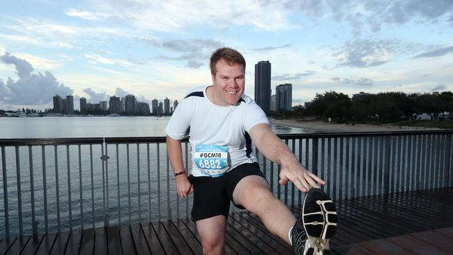 Gold Coast Bulletin reporter Alister Thompson stretching before the race. Photo by Richard Gosling