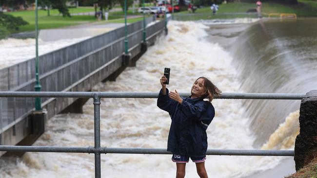 Jersey Ford, 10, checks out Aplins Weir is it overflows. Picture: Adam Head