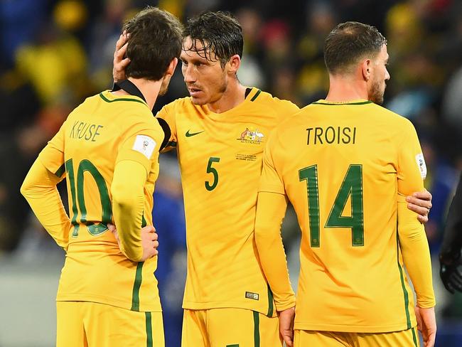 Robbie Kruse, Mark Milligan and James Triosi.