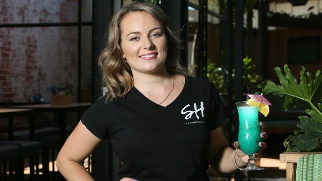 Bar manager Jacquline Malpass delivering a cool cocktail in the beer garden Somerset Hotel. Picture: AAP/Emma Brasier