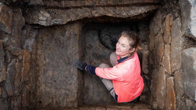 Researcher Liesel Gentelli works in the site of the original cesspit. Picture: Mark Stewart