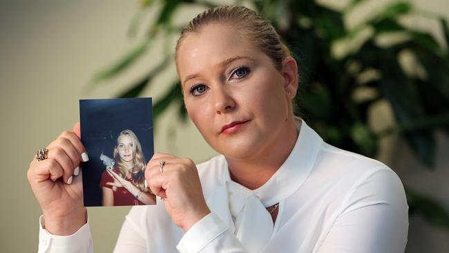 Virginia Guiffre holds a photo of herself at age 16, when she says Palm Beach multimillionaire Jeffrey Epstein began abusing her sexually. Picture: Getty