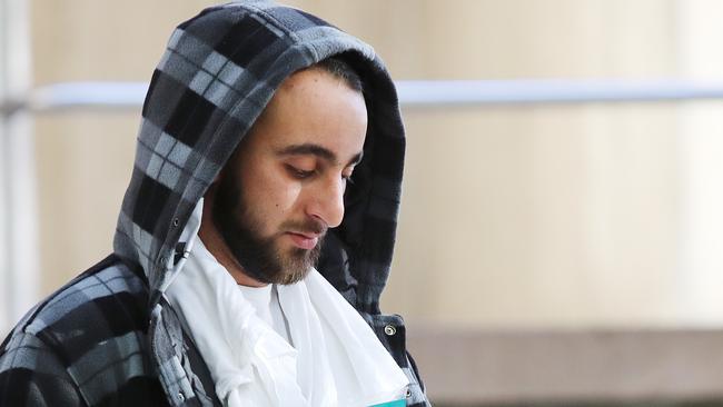 Pictured leaving Sydney Police Centre in Surry Hills is Gazwan Shahrouk, one of six people arrested in conjunction to a case of fraud involving the NDIS. Picture: Richard Dobson