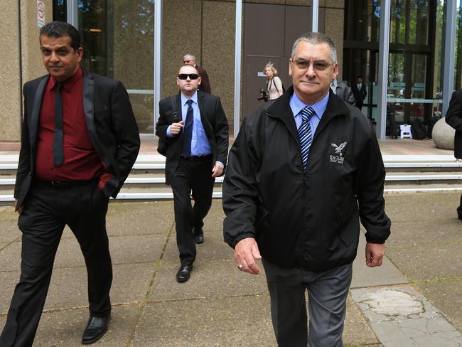 Robert Adams (centre) and his work colleagues outside the Supreme Court in Sydney. Picture: Toby Zerna