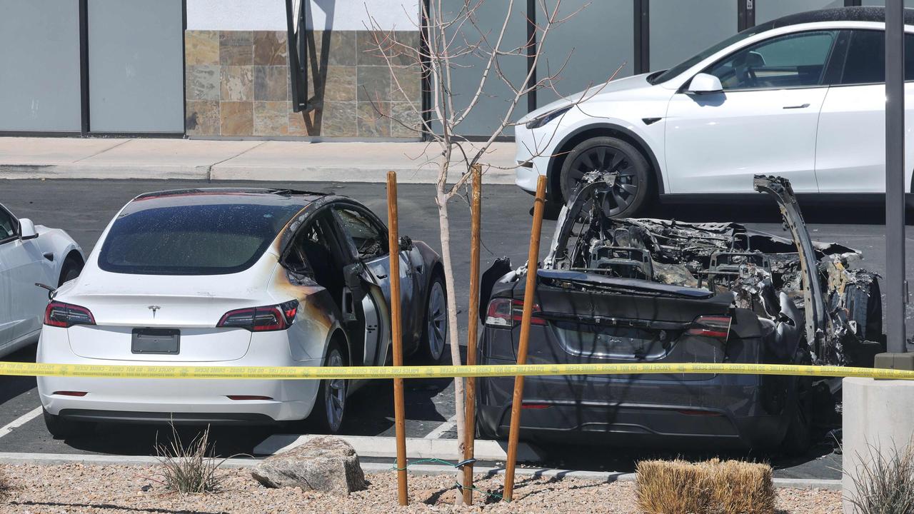 <!DOCTYPE html PUBLIC "-//W3C//DTD HTML 4.0 Transitional//EN" "http://www.w3.org/TR/REC-html40/loose.dtd"><html><body><p>The scorched Teslas were roped off with police tape at the scene. Picture: Ethan Miller/Getty Images via AFP</p></body></html>